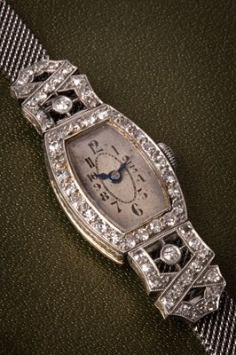 Lot 113 - A lady's Art Deco diamond set cocktail wristwatch