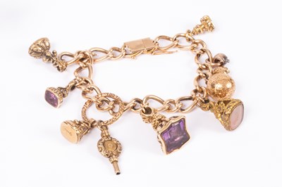 Lot 86 - An 15ct yellow gold curb link charm bracelet