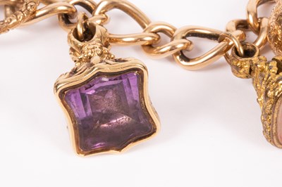 Lot 86 - An 15ct yellow gold curb link charm bracelet