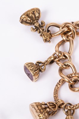 Lot 86 - An 15ct yellow gold curb link charm bracelet