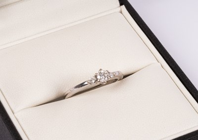 Lot 54 - An 18ct white gold diamond three-stone ring