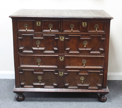 Lot 114 - A 17th Century oak chest of two short and...