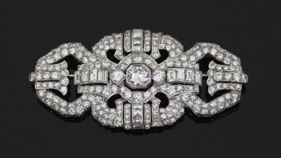 Lot 472 - A diamond brooch of buckle shape, the central...