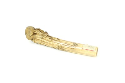 Lot 189 - A Japanese carved bone parasol handle, circa...