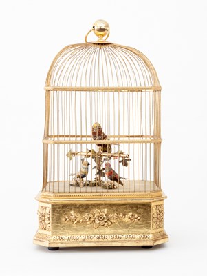 Lot 605 - A 20th Century caged bird musical automaton,...
