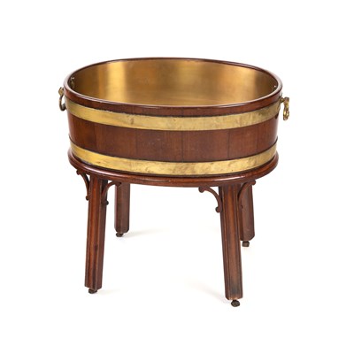 Lot 760 - A George III oval brass bound wine cooler on a...