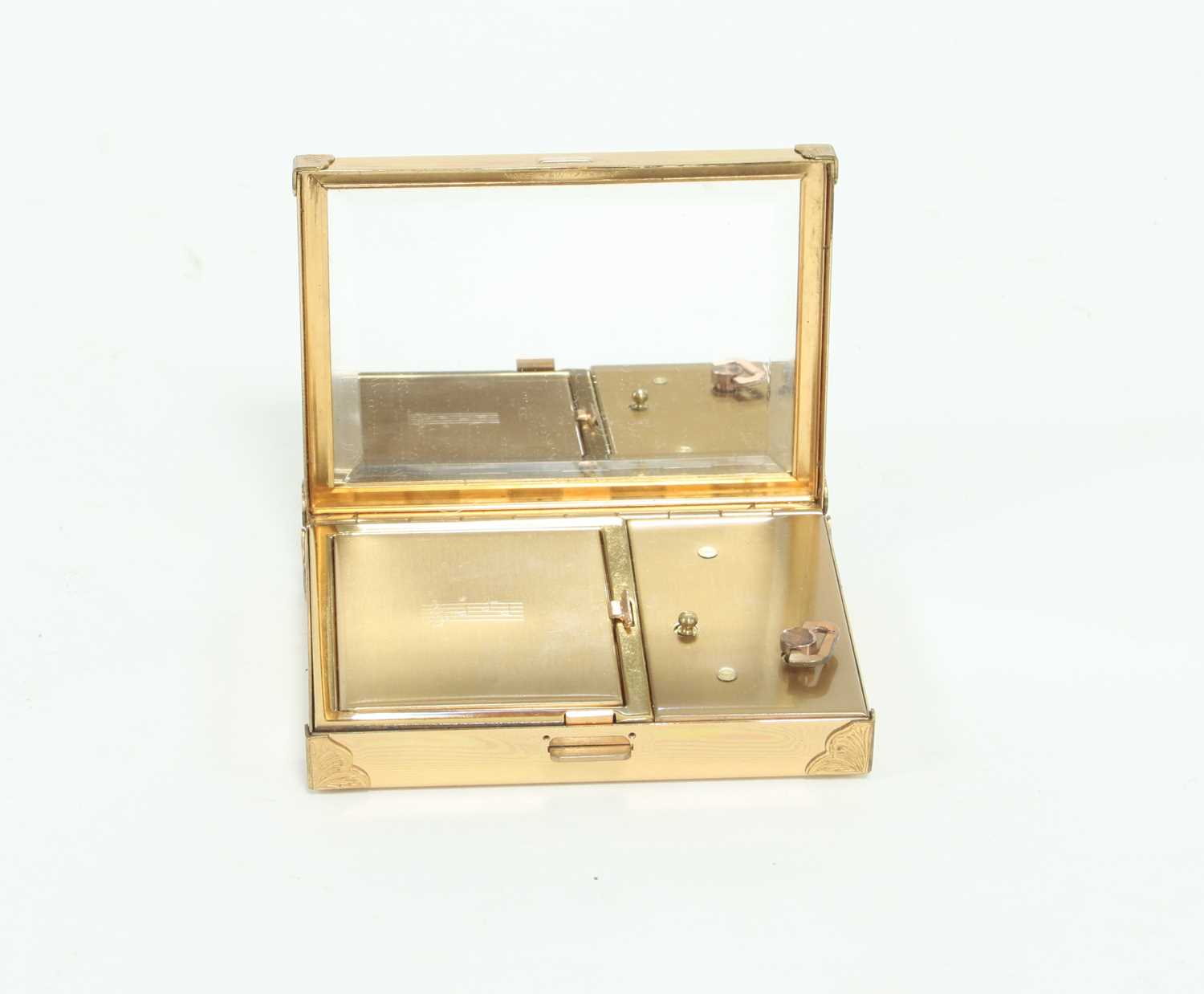 Lot 65 - A Swiss musical compact, the hinged cover...