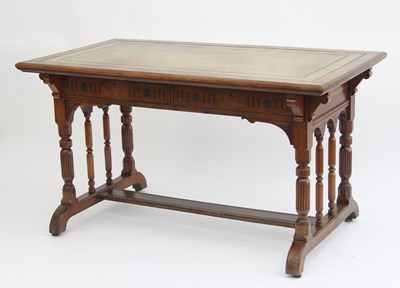 Lot 32 - A walnut writing desk retailed by James Philip,...