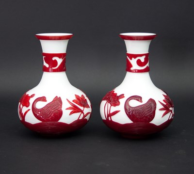 Lot 1064 - A pair of Chinese cameo glass vases, of onion...