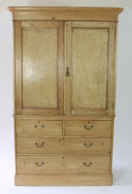 Lot 37 - A Victorian pine linen press, the panel doors...
