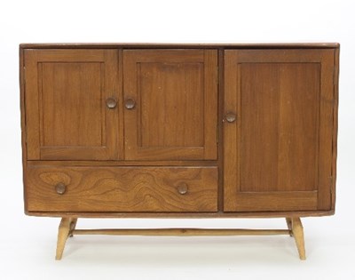 Lot 3 - An Ercol elm sideboard, fitted a single panel...