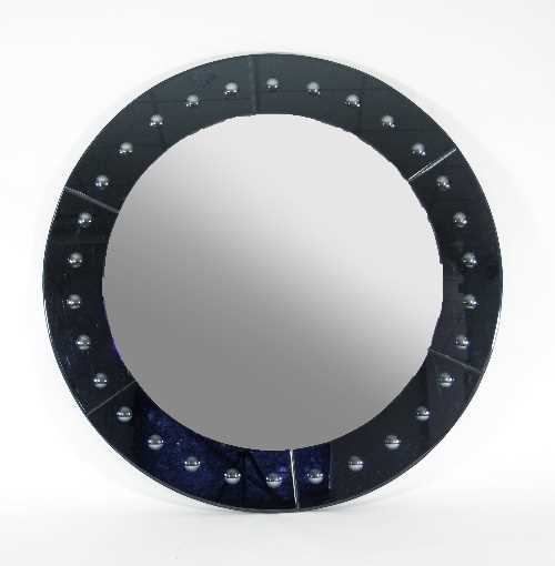 Lot 40 - A very large circular mirror with bevelled...