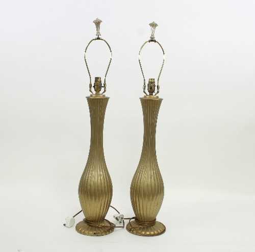Lot 44 - A pair of reeded gilt metal table lamps, 60cm...