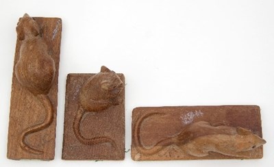 Lot 70 - Three carved oak models of mice, each mounted...