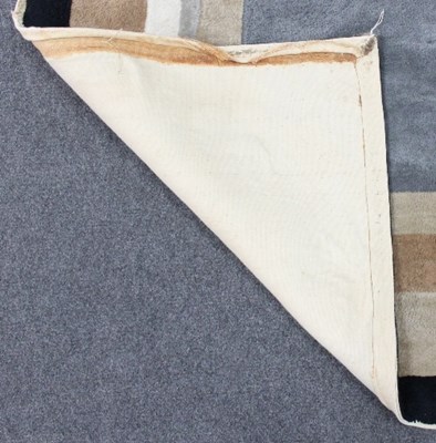 Lot 86 - A mid 20th Century rug with geometric design...