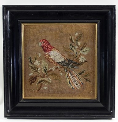 Lot 1034 - A Victorian woolwork picture of a parrot...