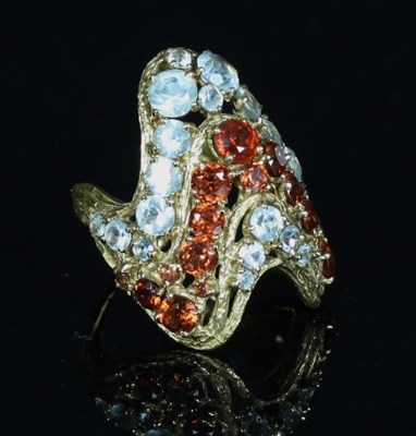 Lot 307 - An aquamarine and garnet ring by H Stern, of...