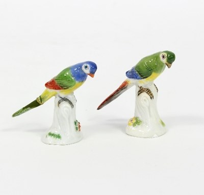 Lot 79 - A pair of miniature Meissen parrots, incised...
