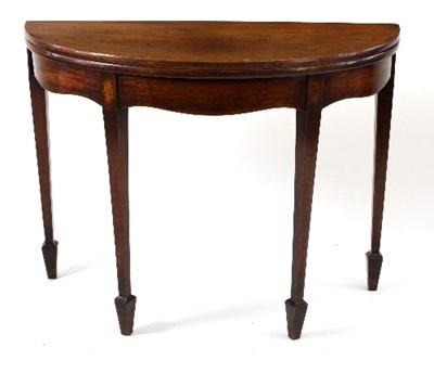 Lot 577 - A late 18th Century mahogany half-round tea...