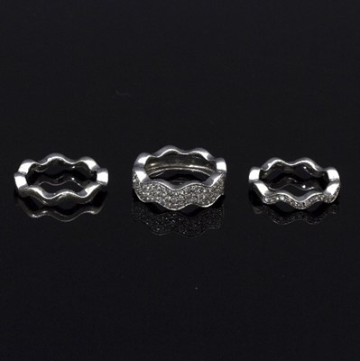 Lot 223 - A set of three contemporary 18ct white gold...