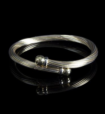 Lot 261 - A tri-coloured gold bracelet, the alternating...