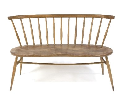 Lot 381 - An Ercol love seat, design 1943, with curved...
