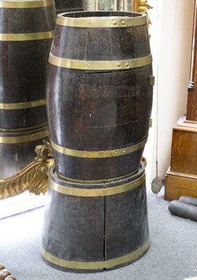 Lot 764 - An oak drinks cupboard of barrel form on...