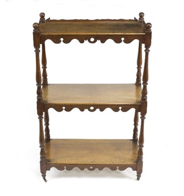 Lot 782 - A mahogany three-tier whatnot with scroll and...