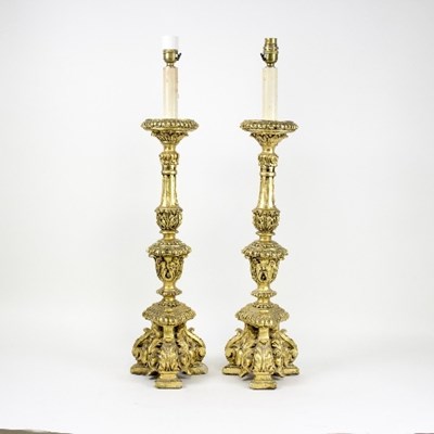 Lot 1273 - A pair of Italian style giltwood table lamps...