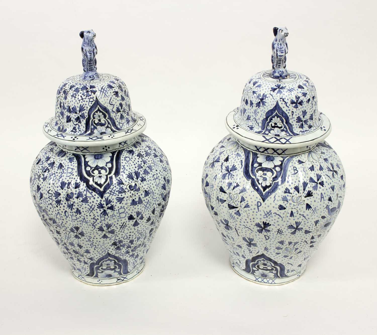 Lot 168 - A pair of modern blue and white Delftware jars...