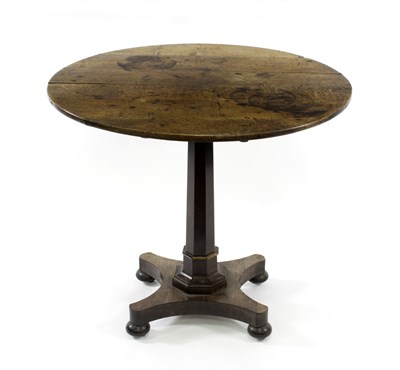 Lot 659 - A circular oak table with octagonal column and...