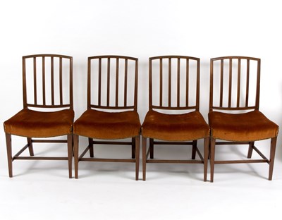 Lot 585 - A set of four rail back dining chairs