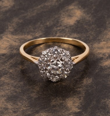 Lot 63 - An 18ct yellow gold and diamond flower head cluster ring