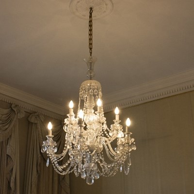 Lot 1020 - A pair of ten-light chandeliers hung festoons...