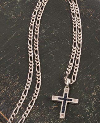 Lot 69 - A 9ct white gold, sapphire and diamond cross pendant