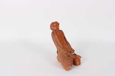 Lot 46 - A Japanese pottery figure of a kneeling man,...