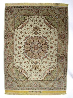 Lot 428 - A pair of Isfahan silk rugs, each with central...