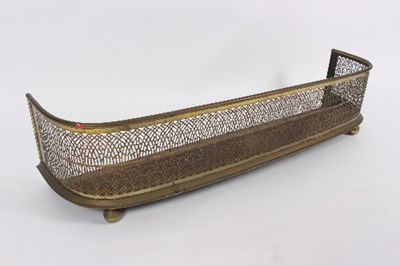 Lot 462 - A Georgian D-shaped brass fender, 115cm wide