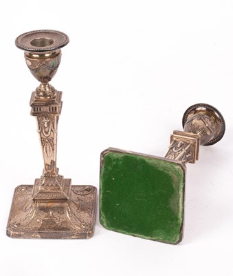 Lot 34 - A pair of Edwardian silver candlesticks