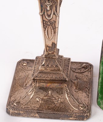 Lot 34 - A pair of Edwardian silver candlesticks