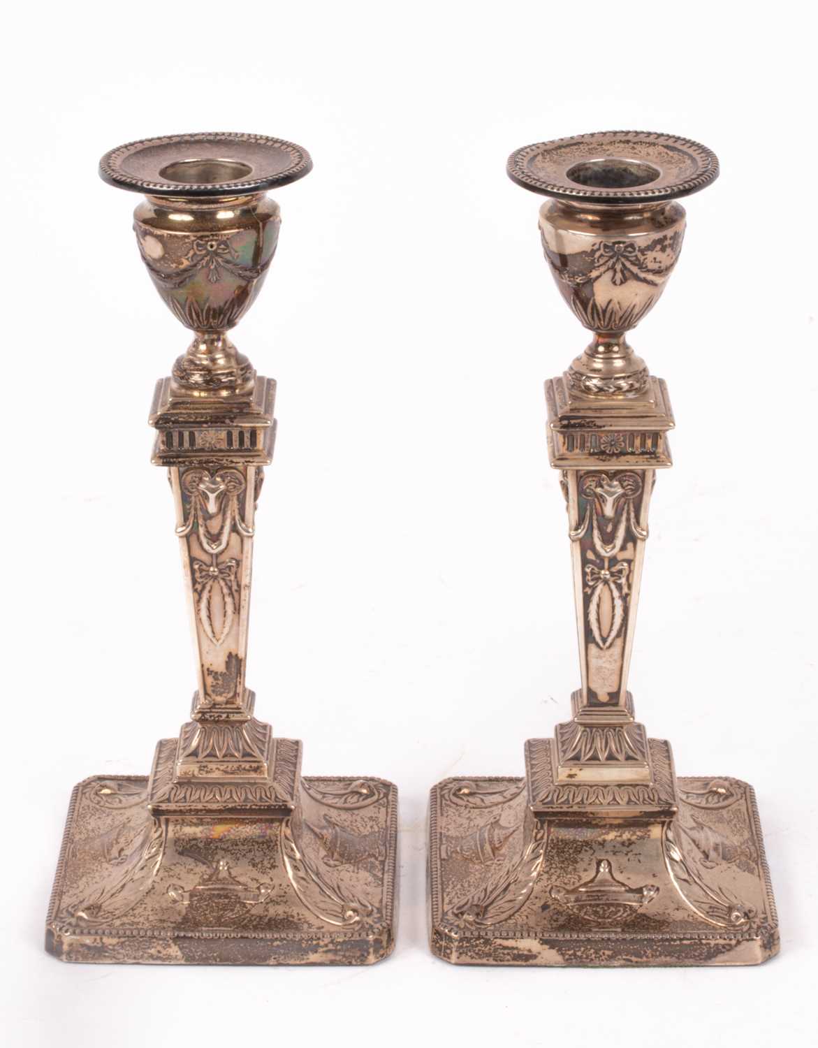 Lot 34 - A pair of Edwardian silver candlesticks