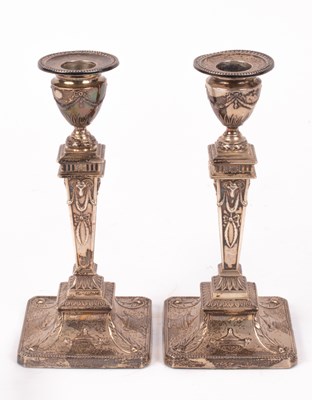 Lot 34 - A pair of Edwardian silver candlesticks