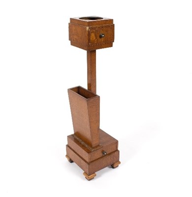 Lot 37 - An Art Deco oak smoking stand on a square base...