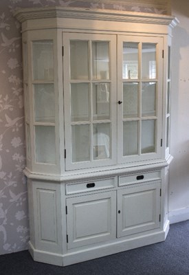 Lot 68 - A painted display cupboard by Oka, the shelved...