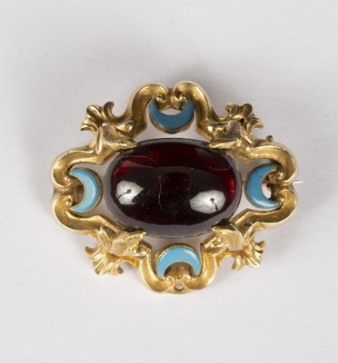 Lot 598 - A garnet and enamelled brooch, the oval...