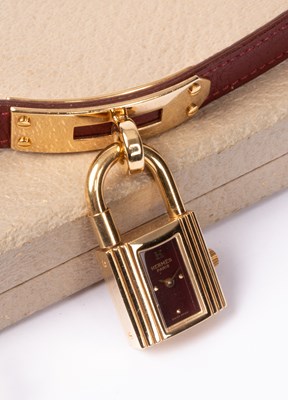 Lot 110 - A lady's Hermès Kelly gold plated quartz wristwatch