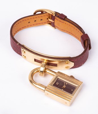 Lot 110 - A lady's Hermès Kelly gold plated quartz wristwatch