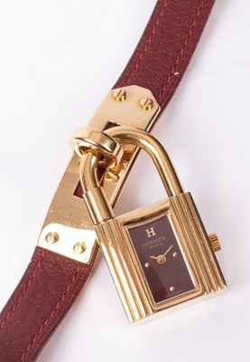 Lot 110 - A lady's Hermès Kelly gold plated quartz wristwatch
