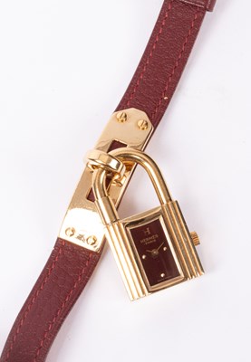Lot 110 - A lady's Hermès Kelly gold plated quartz wristwatch