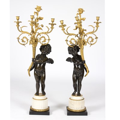 Lot 978 - A pair of mid 19th Century ormolu three-branch...